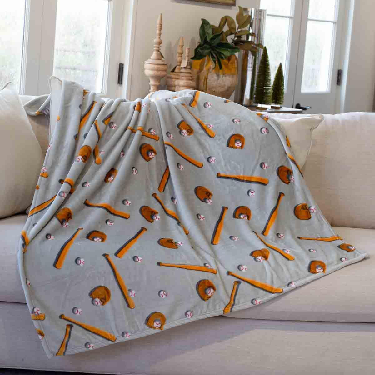 Gray baseball throw blanket with brown gloves, bats, and baseball print
