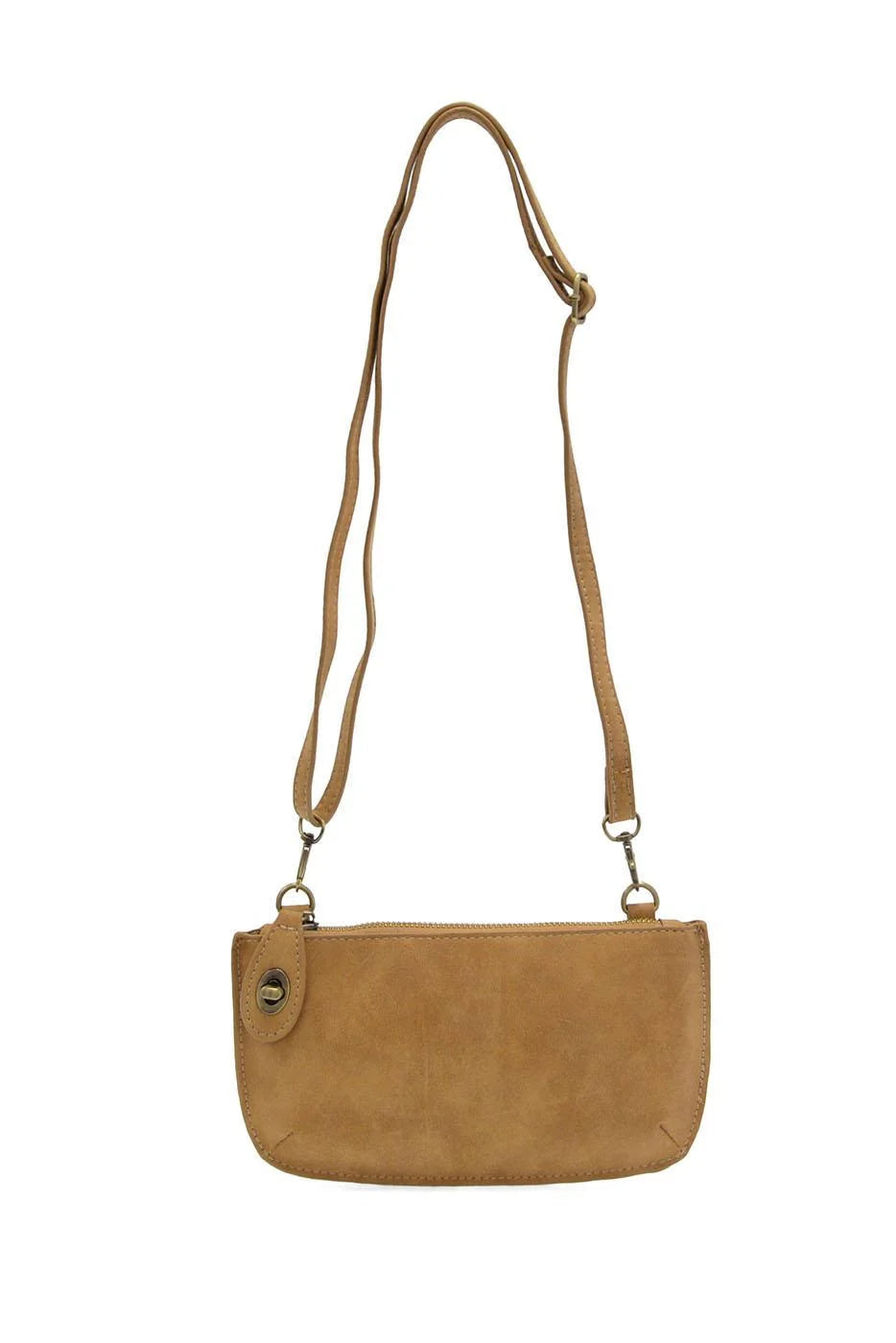 A tan suede crossbody bag with a long adjustable shoulder strap and a small metal snap button detail on the front, shown against a plain white background.