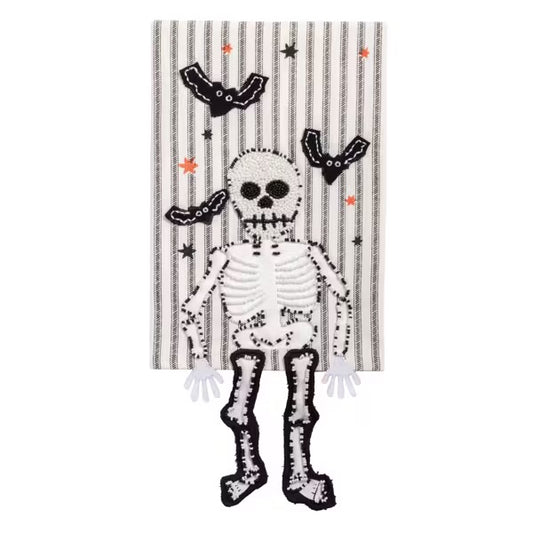 Decorative towel with a skeleton design on a striped background