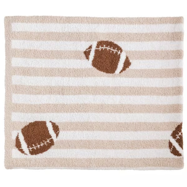 Striped rug with football designs on a beige and white background