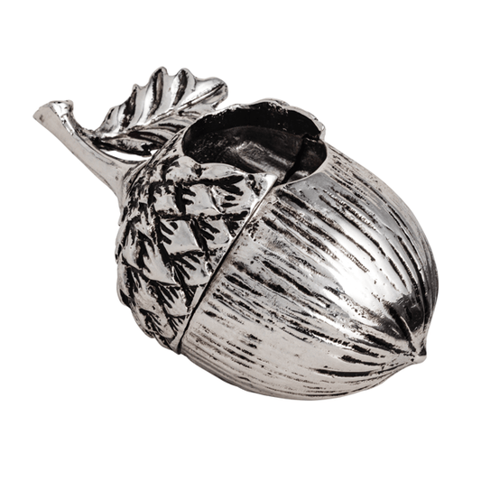 A metallic silver acorn-shaped container with a textured shell and leaf detail, shown on a plain white background.