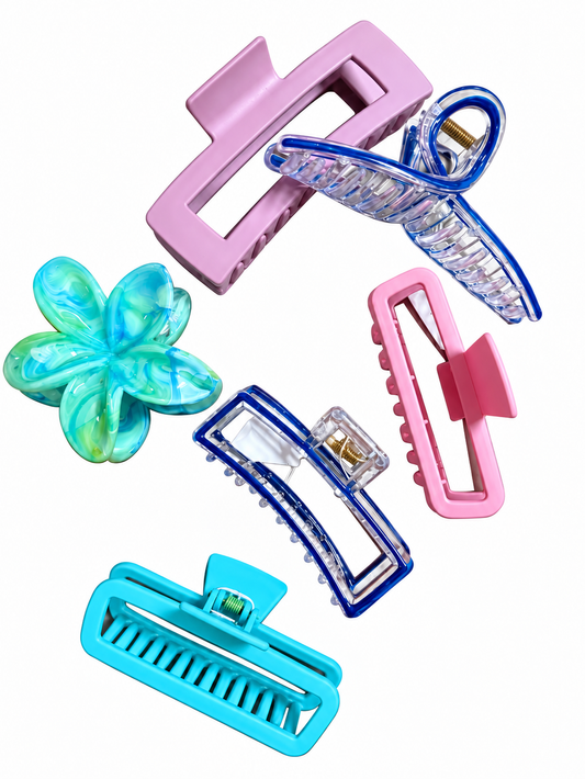 Assorted colorful hair claw clips in pink, blue, turquoise, and floral styles on white background