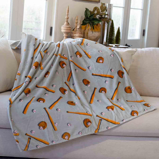 Gray baseball throw blanket with brown gloves, bats, and baseball print