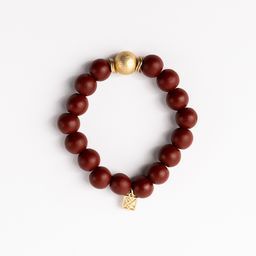 crimson beaded bracelet with one gold bead