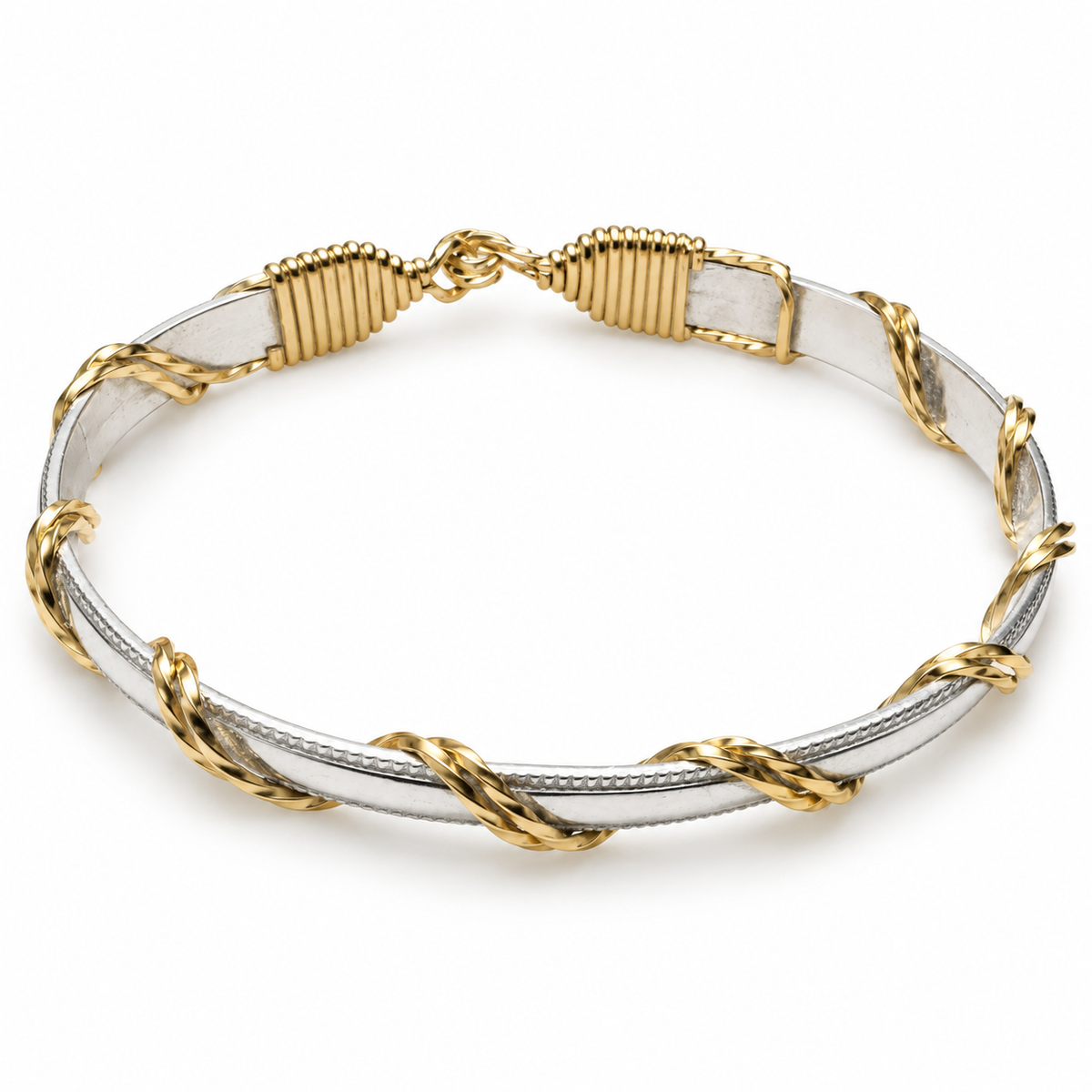 14k Gold-filled wire and Sterling Silver handcrafted bracelet. Sterling Silver band with 14k Gold filled wraps.