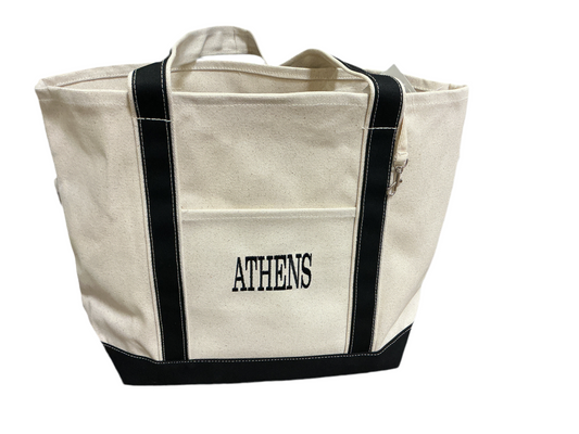 Beige tote bag with black accents and 'ATHENS' text on a white background with outside pocket and black straps