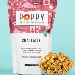 Poppy hand-crafted popcorn bag with 'Chai Latte' flavor on a light blue background