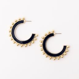 large hoop earrings with navy enamel color and gold beads lining the exterior
