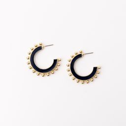medium hoop earrings with navy enamel color and gold beads lining the exterior
