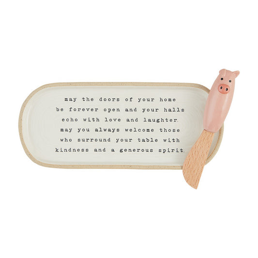 stoneware dish with coordinating decorative pig spreader