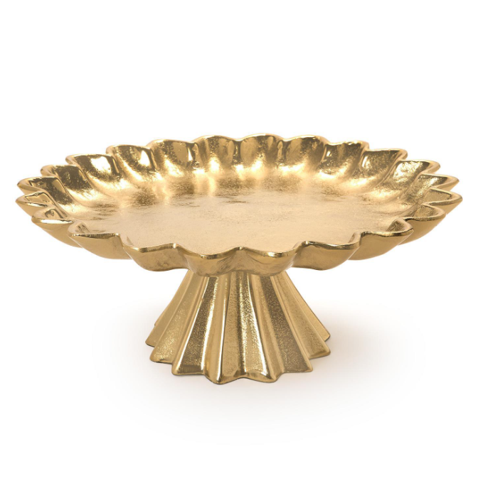 A gold pedestal platter with a scalloped rim and fluted base, shown on a plain white background.