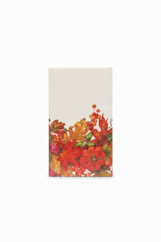 A rectangular cream-colored napkin or paper towel with a colorful autumn floral print along the bottom half, featuring red, orange, and yellow leaves and berries, shown against a plain white background.