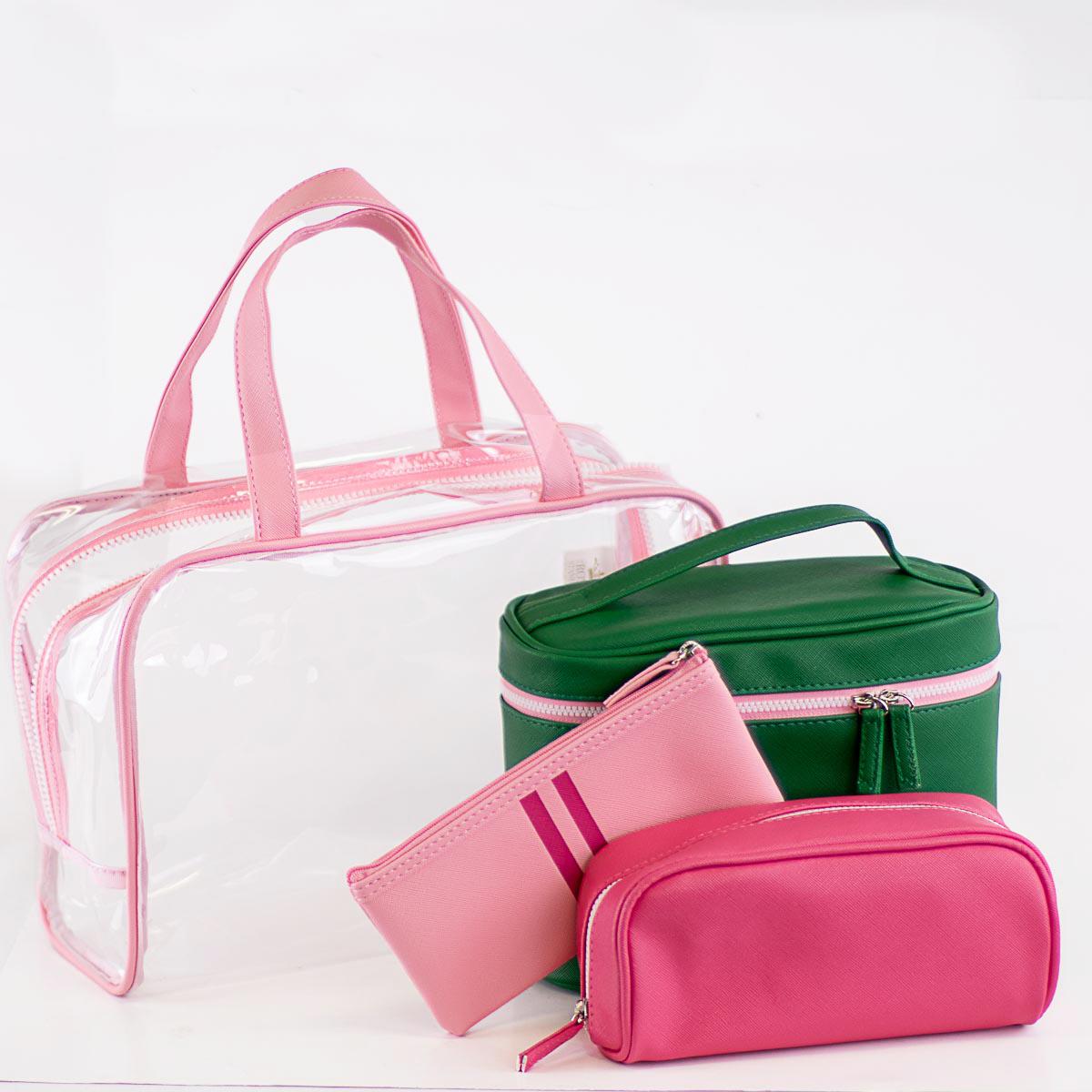 Pink, green, and clear zippered cosmetic and travel bags with top handles