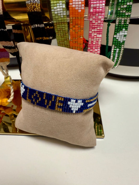 royal blue seed bead bracelet with gold an white accents spelling love