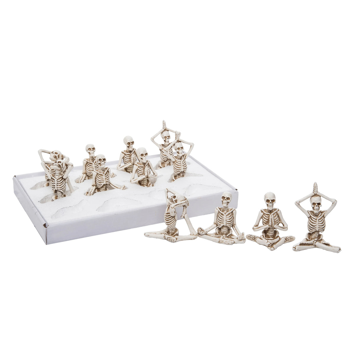 Set of small skeleton figures in various poses on a white background
