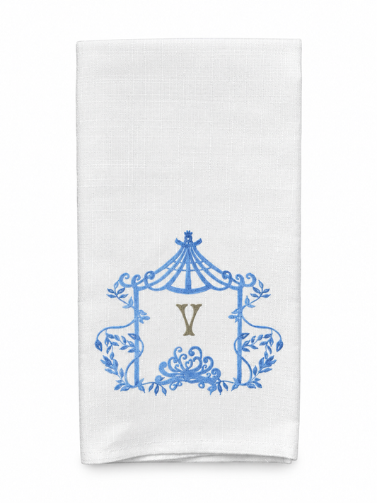 A white kitchen towel featuring a blue ornate crest design with a central gold monogram letter 'Y', shown against a plain white background.