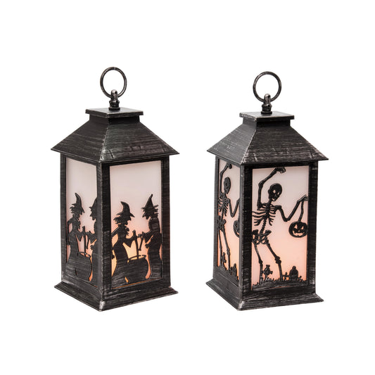 Two Halloween-themed lanterns with silhouettes of witches and skeletons on a white background.
