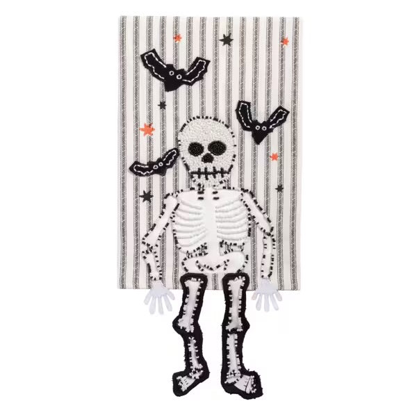 Decorative towel with a skeleton design on a striped background