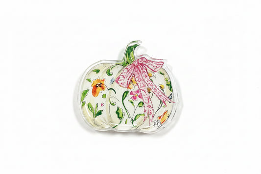 A clear acrylic pumpkin-shaped accessory featuring a hand-painted floral design with green leaves, orange and pink flowers, and a pink patterned bow on a white background.