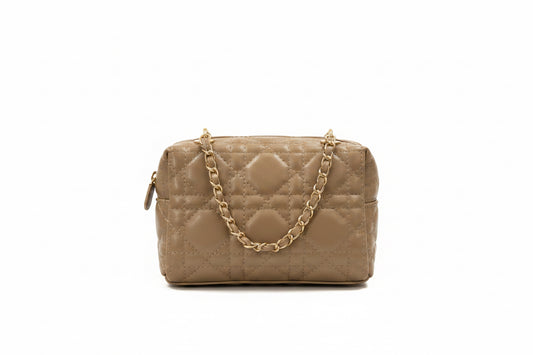 A quilted beige shoulder bag with a gold-tone chain strap, shown against a plain white background.