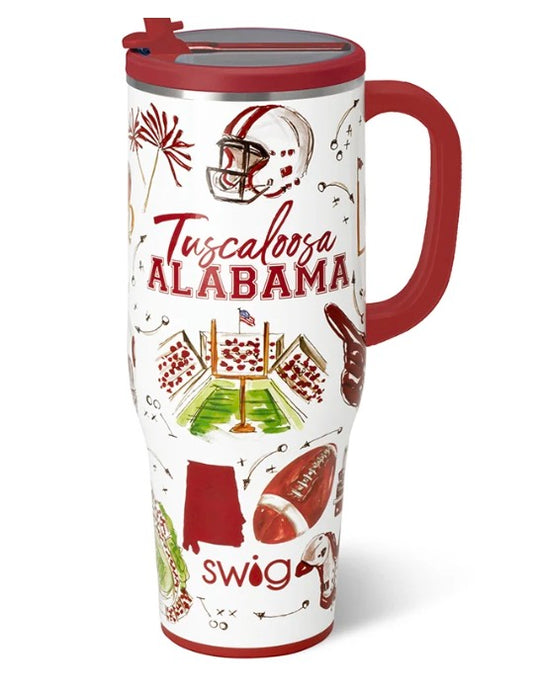 A white insulated travel tumbler with a red handle and lid, decorated with Tuscalosa Alabama football graphics including a helmet, stadium, football, and the words 'Tuscalosa ALABAMA' and 'swig'.