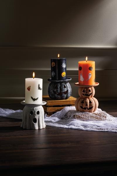 Terra Ghost Pillar Holder is a charming addition to your home decor, crafted from high-quality terracotta. This unique pillar candle holder features intricate cut-out facial features that add a whimsical touch to any room. 