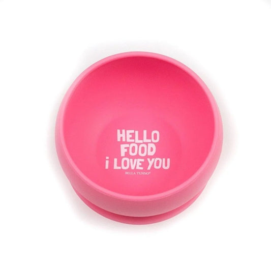 A bright pink silicone baby bowl with a suction base, featuring the white printed text 'HELLO FOOD i LOVE YOU' and the brand 'BELLA TONDO' on the inside, set against a plain white background.