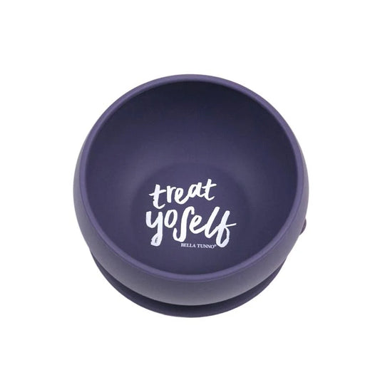 A dark purple silicone baby  bowl with a white printed graphic that reads 'treat yoSelf' and 'BELLA TUNNY' underneath, shown on a plain white background.