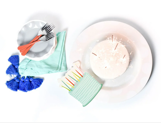 Sparkle Cake Big Attachment by happy everything in a mint green background with colorful sparkle candles on top displayed on a large white platter with birthday cake and decorative bowls and towels.